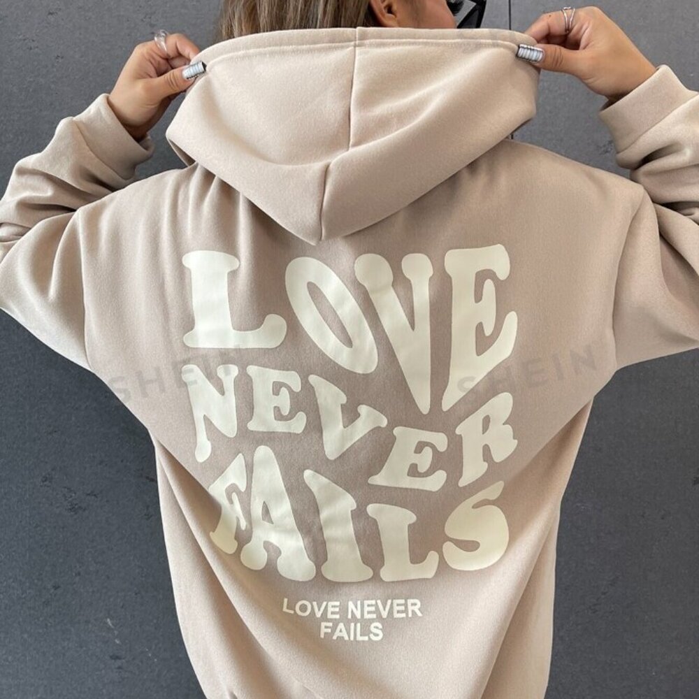 Love Never Fails sweatshirt L
